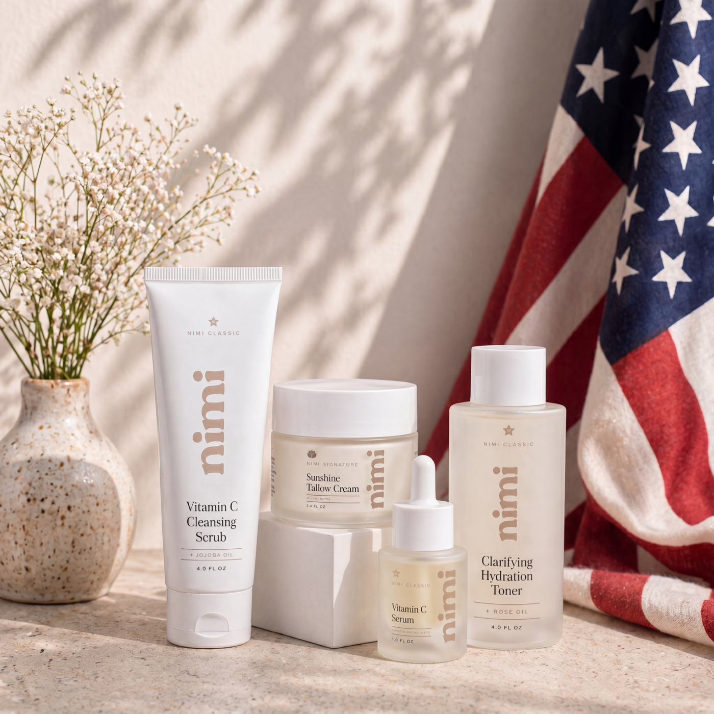 The Sunshine Bundle, four Nimi Skincare products styled with an American flag
